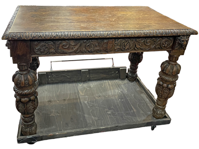 Ancient Heavily Carved Table On Castors With Brake Props, Prop Hire